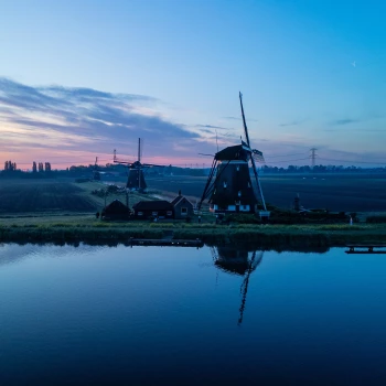 Three windmills at sunrise